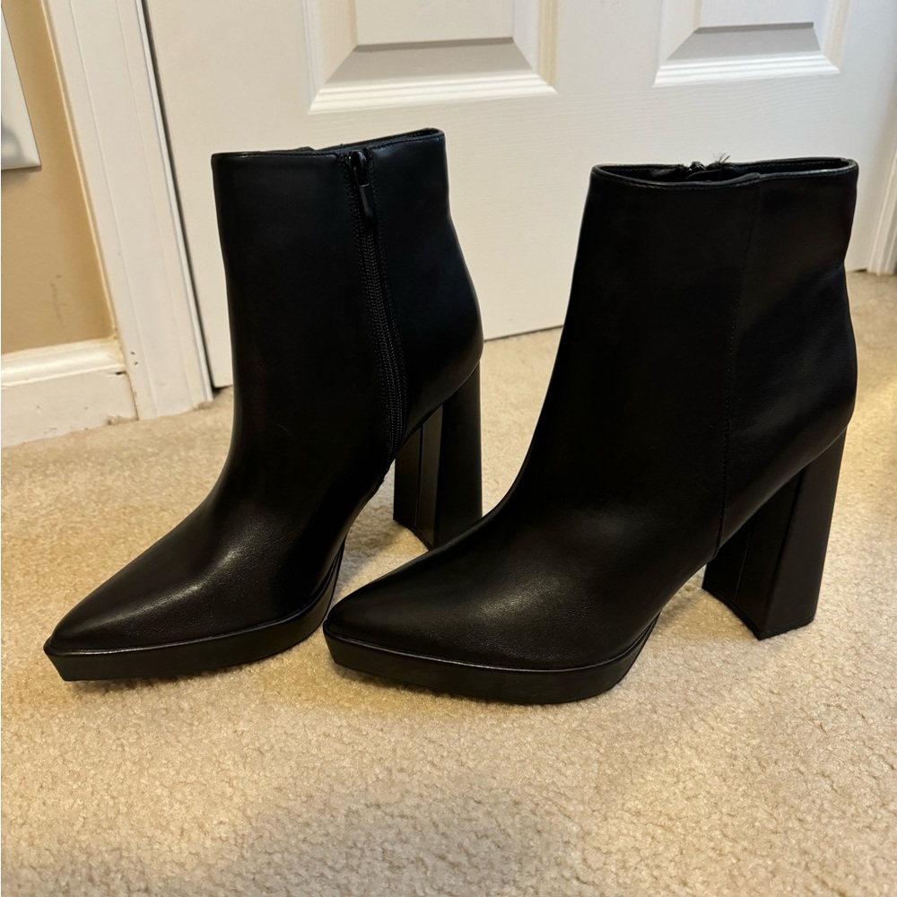 Black ankle boots. Never worn. Size 9.5- 5 inch heel with 1 inch platform.